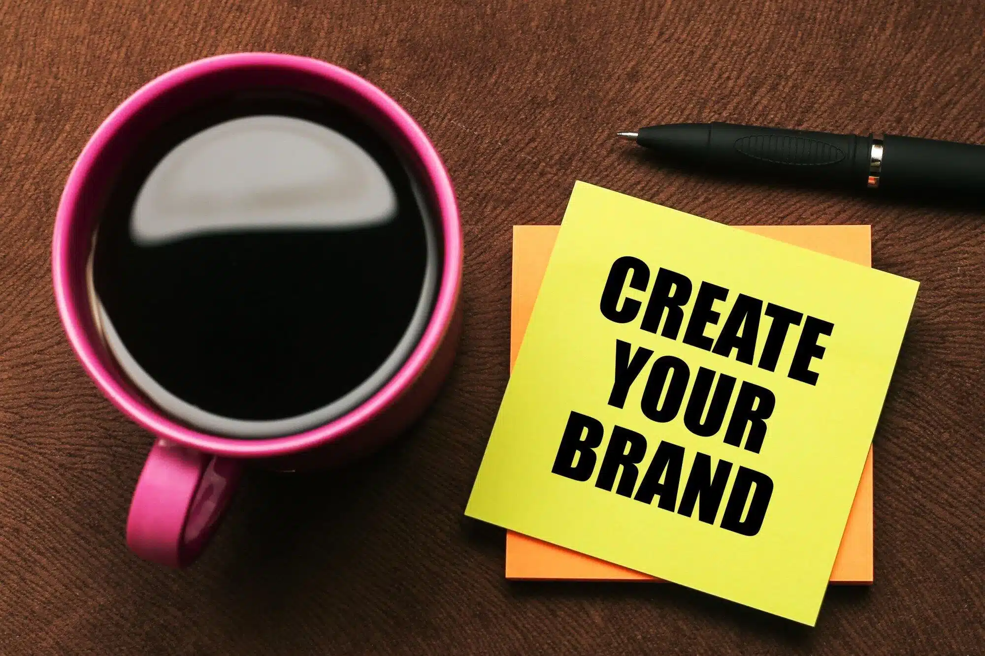 promotional mug next to post it note with create your brand